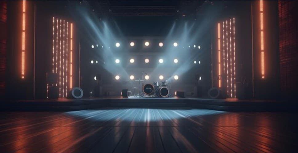 a stage with a drum set and a set of lights