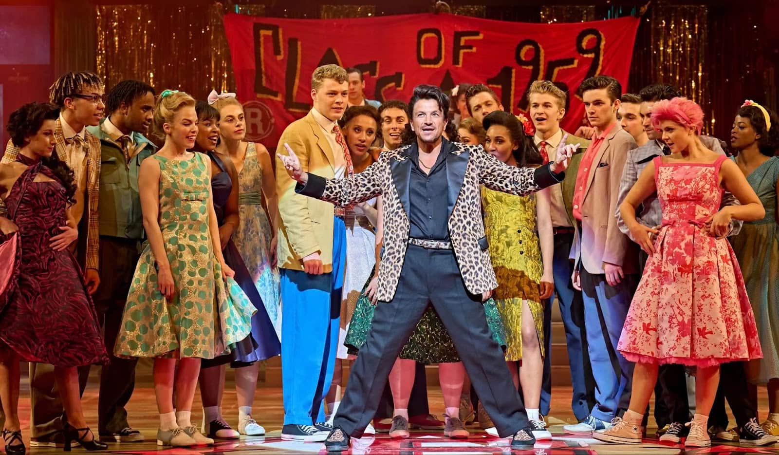 A group of people on stage performing a play