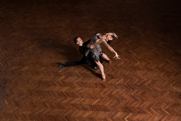 A guy and a girl dancing on stage